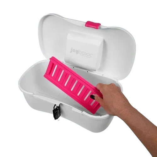 Hand placing pink tray inside white hygienic storage box with secure latch