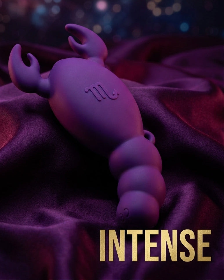 A purple silicone personal massager shaped like a scorpion, resting on draped dark purple fabric with a blurred bokeh background. The text 'Sexy Scorpio' is written at the top, and 'INTENSE' is written at the bottom in gold.